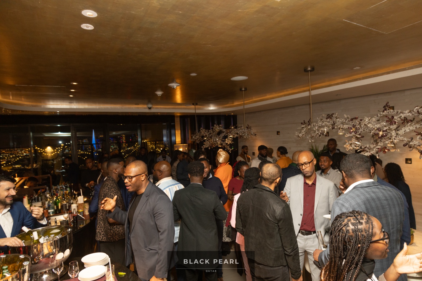 A crowded, warmly lit Black Pearl evening in full swing