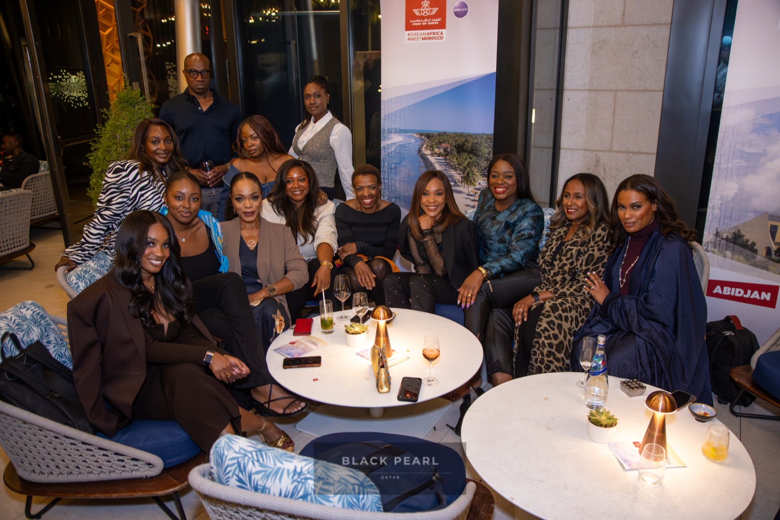 A group of Black Pearl members gathered together at an evening lounge